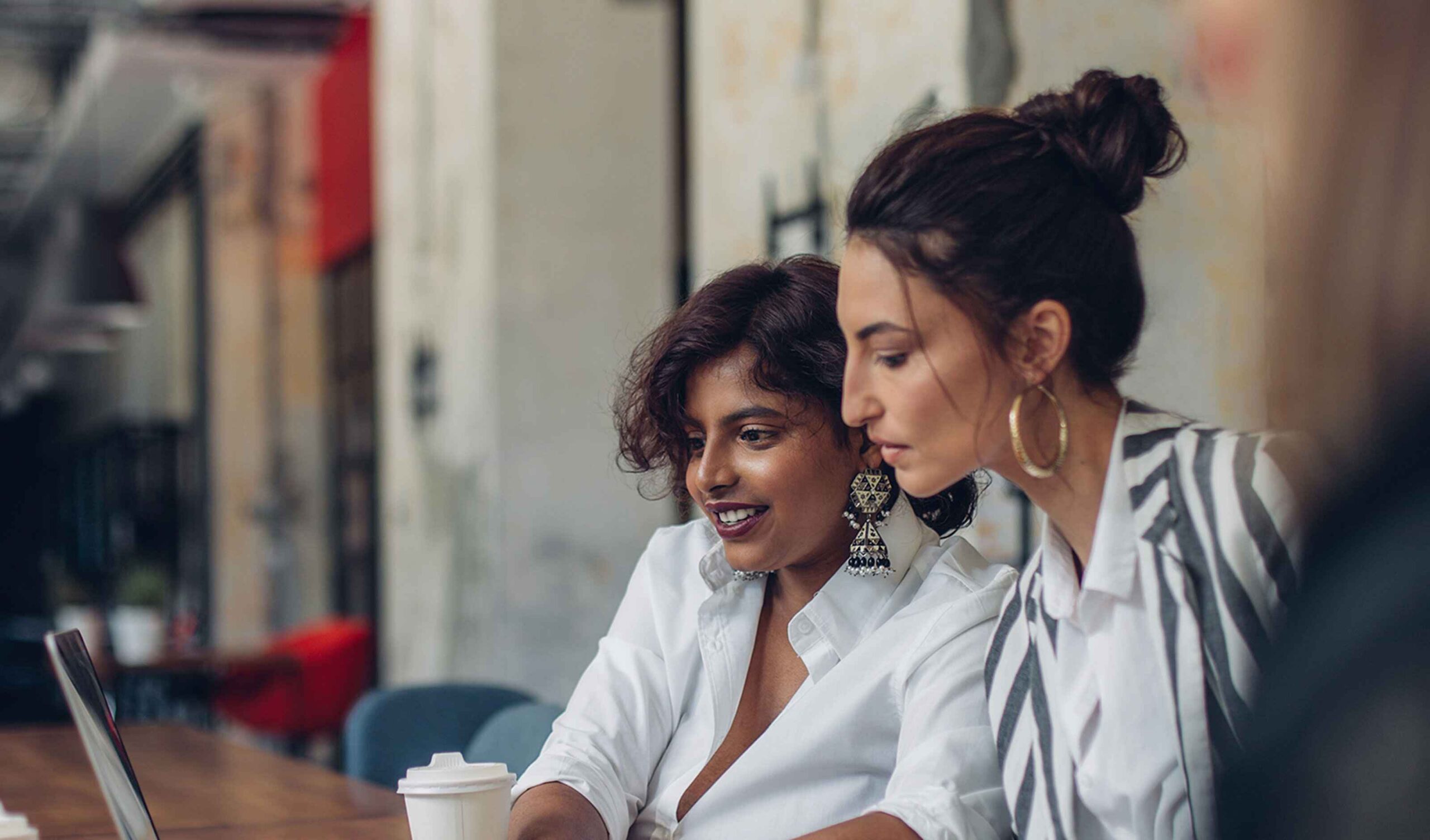 Two Girls looking at laptop